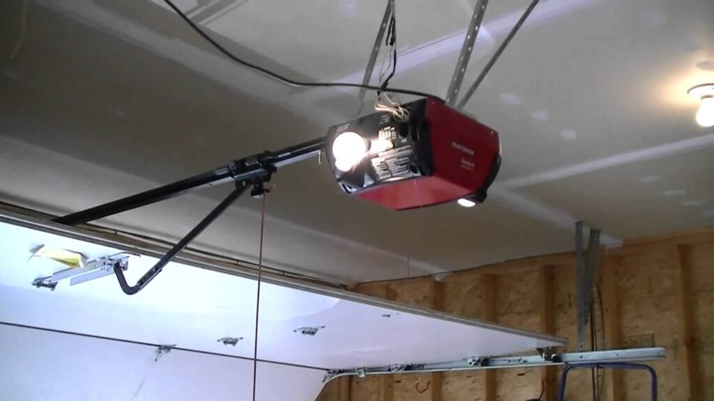 Close-up of a Craftsman garage door opener with a spotlight,